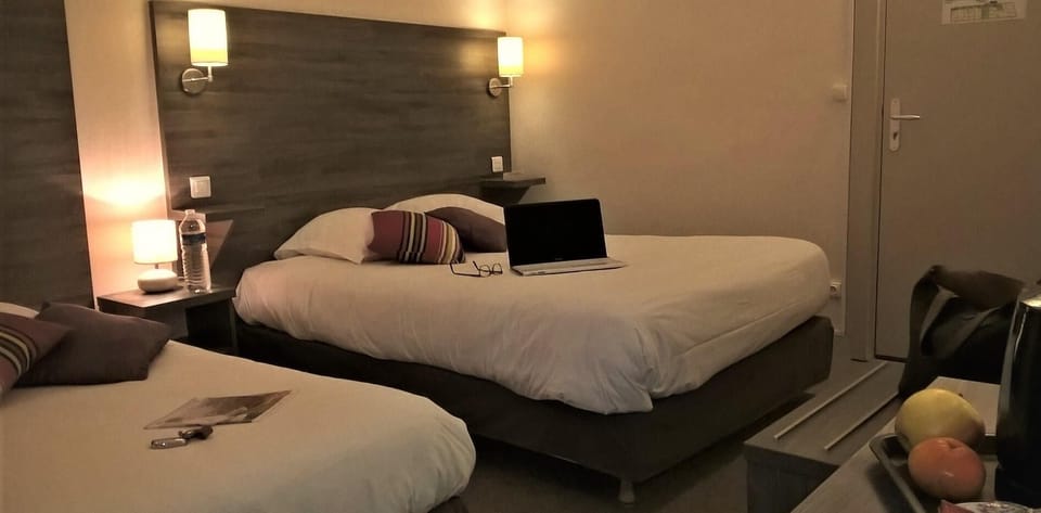 Triple Room | Desk, blackout drapes, soundproofing, iron/ironing board (on request)