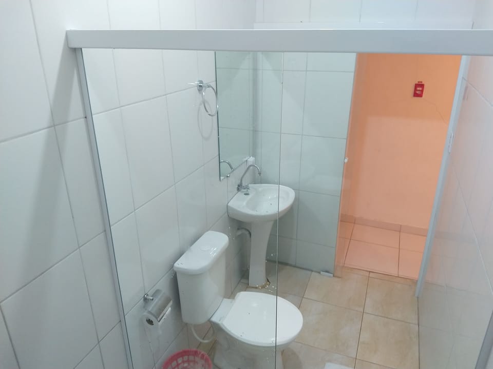 Standard suite with window | Bathroom | Shower, rainfall showerhead, towels, soap