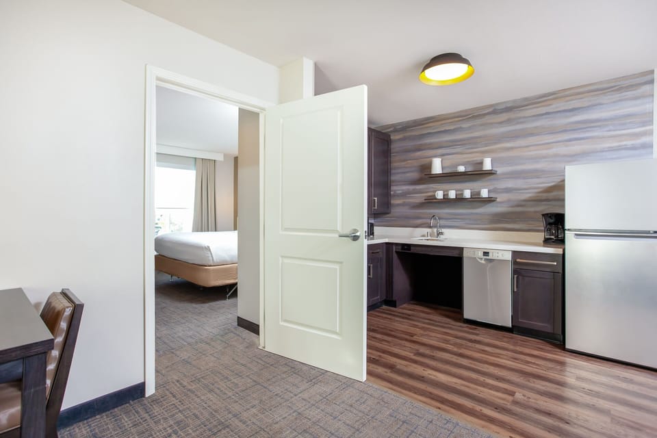 Suite, 1 King Bed with Sofa bed (Mobility Accessible, Tub) | Private kitchen | Coffee/tea maker, dining tables