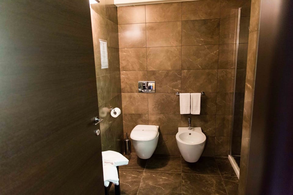Shower, rainfall showerhead, designer toiletries, bathrobes