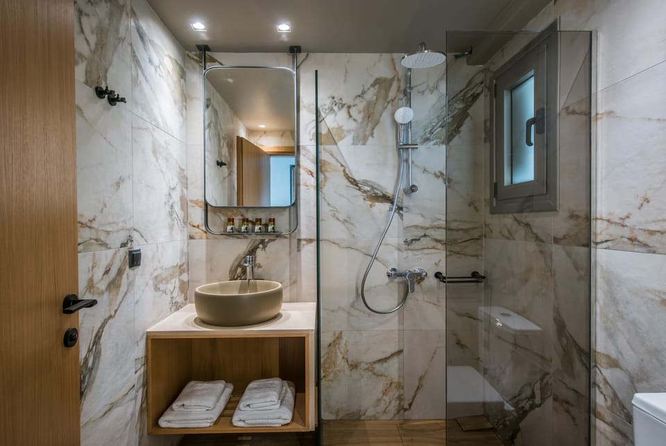 Shower, free toiletries, hair dryer, slippers
