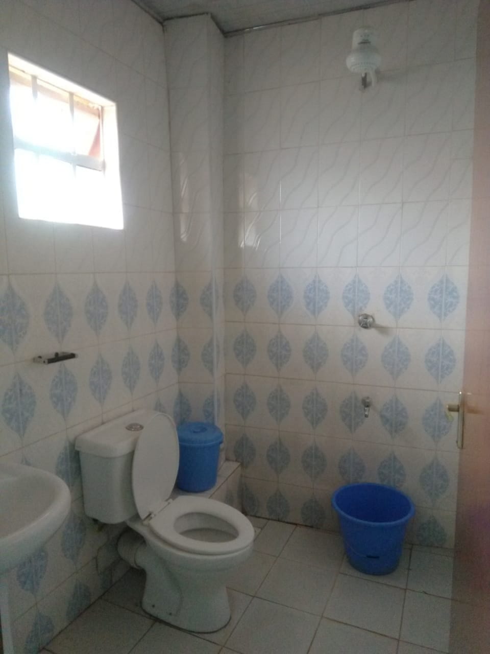 Shower, rainfall showerhead, slippers, towels