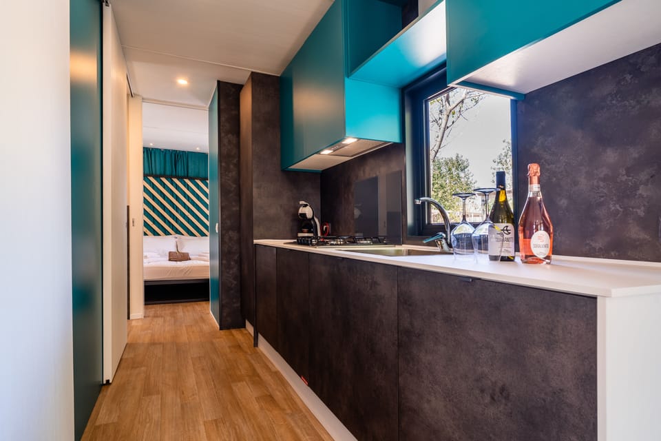 Elite Mobile Home | Private kitchen | Full-size fridge, microwave, stovetop, espresso maker