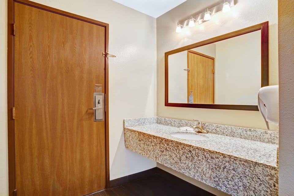Standard Room, 2 Queen Beds | Bathroom | Combined shower/tub, rainfall showerhead, free toiletries, hair dryer