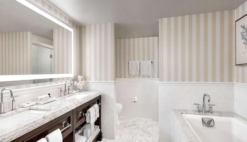 Shower, designer toiletries, hair dryer, bathrobes