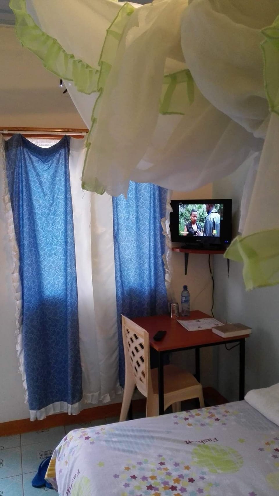 Desk, laptop workspace, bed sheets