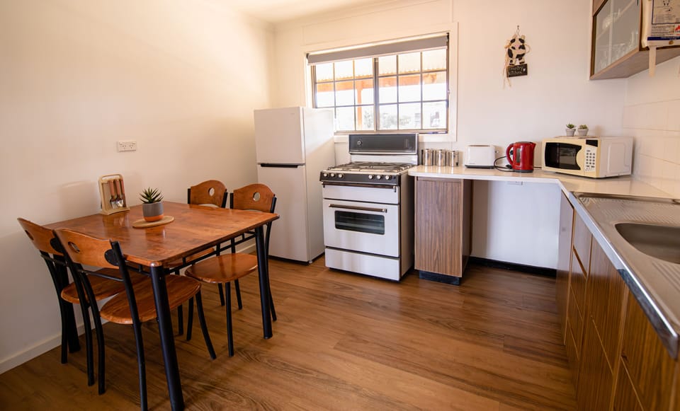 Acacia Cottage | Private kitchen | Fridge, oven, stovetop, cookware/dishes/utensils