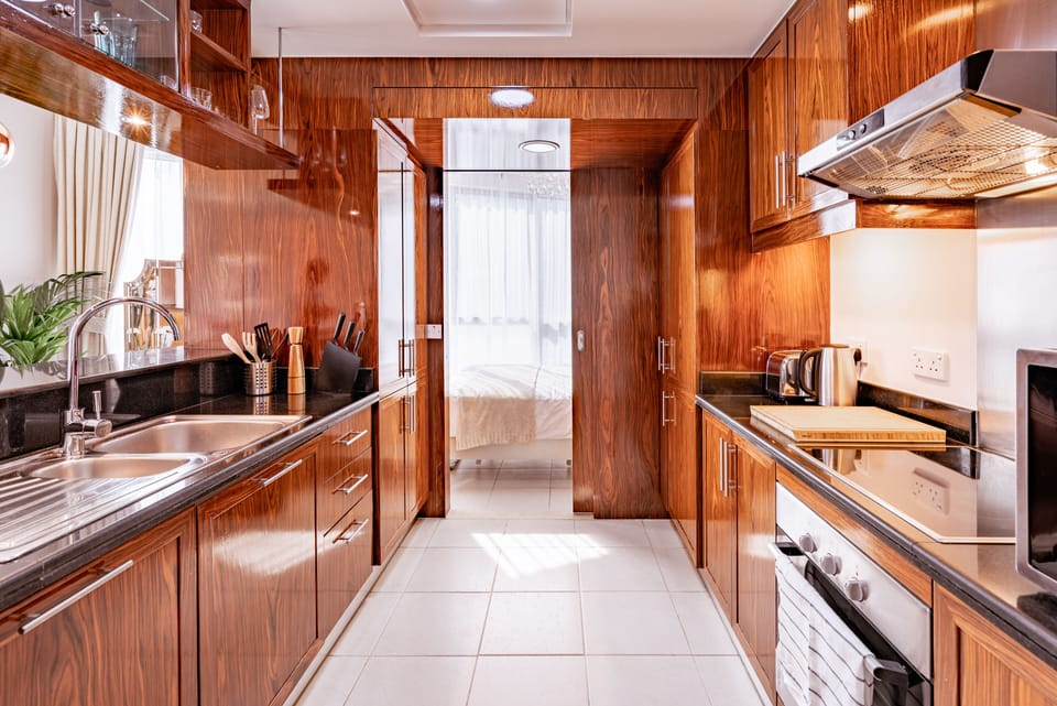 Luxury Apartment | Private kitchen | Full-size fridge, microwave, oven, stovetop