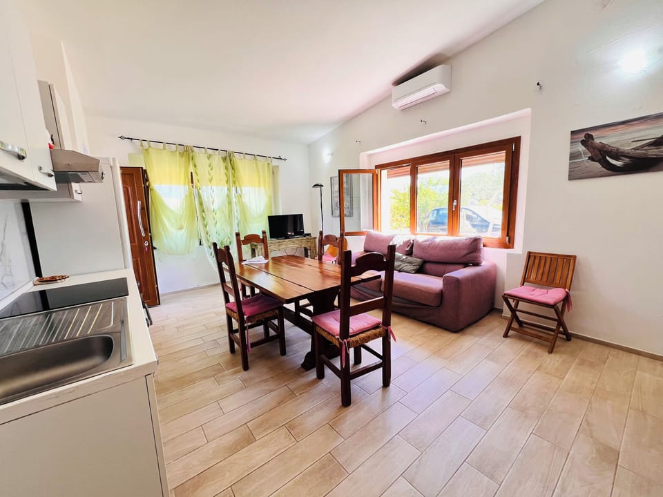 Apartment, 2 Bedrooms | Living area | 22-inch flat-screen TV with cable channels