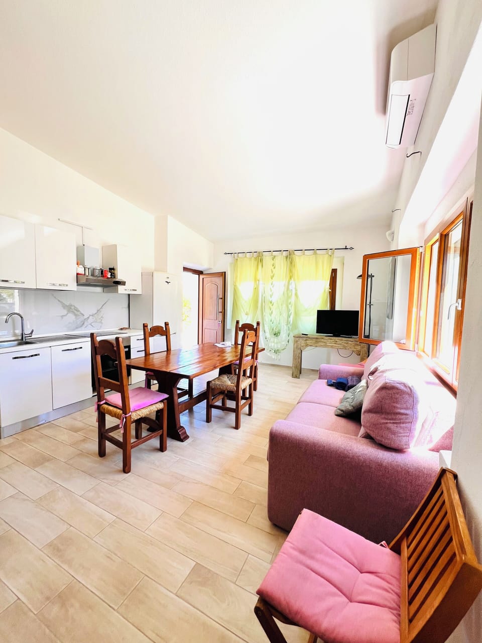 Apartment, 2 Bedrooms | Living area | 22-inch flat-screen TV with cable channels