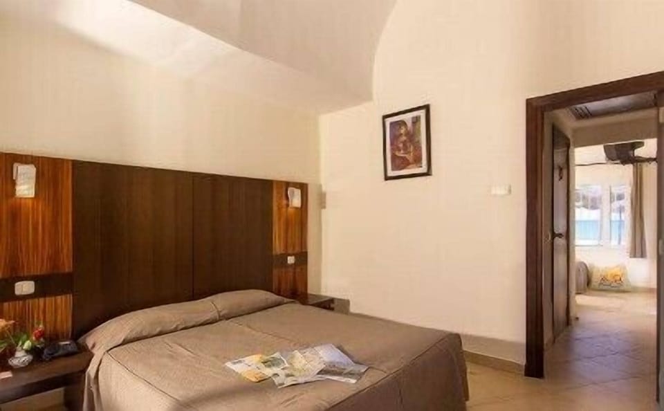 Triple Room | Minibar, in-room safe, individually furnished, desk