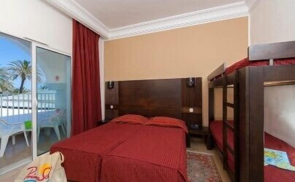 Quadruple Room | Minibar, in-room safe, individually furnished, desk