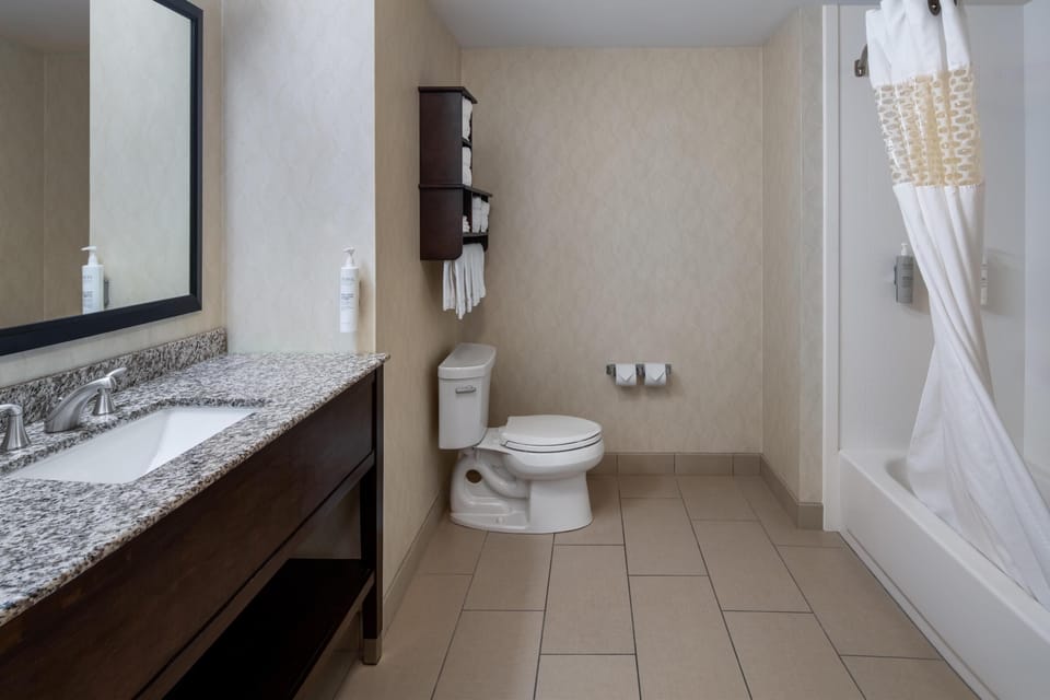 Two Queen Beds | Bathroom | Shower, free toiletries, hair dryer, towels