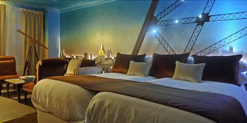 Suite (Eiffel) | Minibar, in-room safe, individually decorated, desk