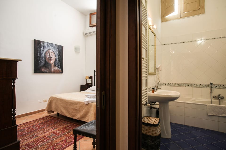 Family Apartment, 1 Bedroom, Kitchen, City View | Bathroom | Hair dryer, bathrobes, bidet, towels