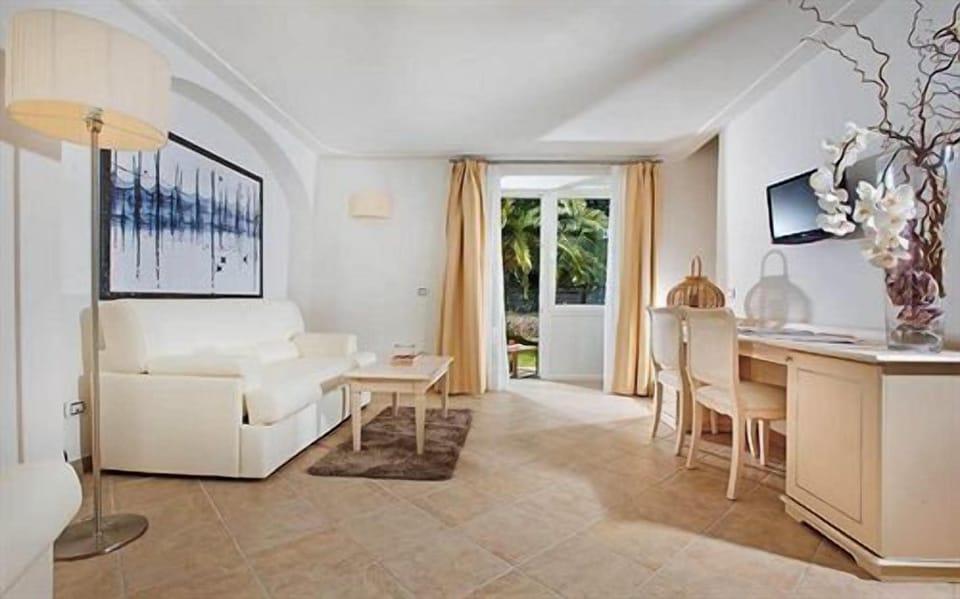 Family Apartment, 1 Bedroom, Partial Sea View | Living room | Flat-screen TV