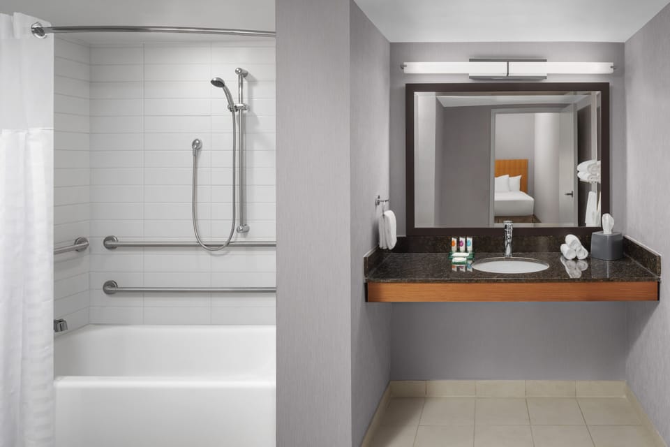 Designer toiletries, hair dryer, towels