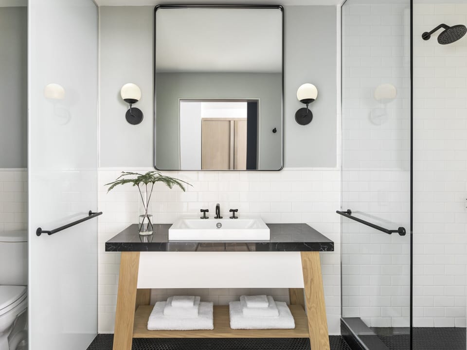 Designer toiletries, hair dryer, towels, soap