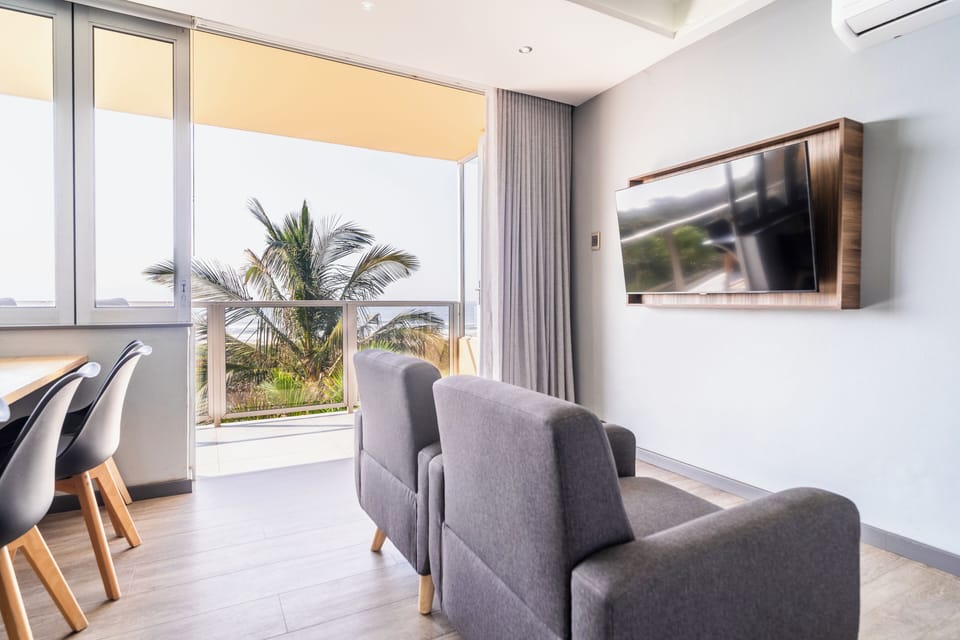 6 Sleeper Upgraded Flat with Balcony (26) | Living area | 32-inch TV with satellite channels, table tennis