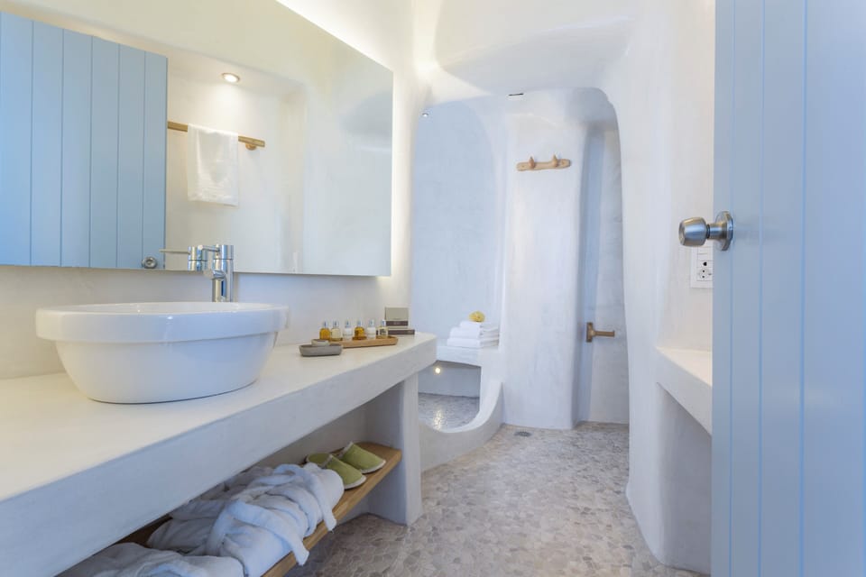 Villa Phos with Caldera View | Bathroom | Shower, designer toiletries, hair dryer, slippers