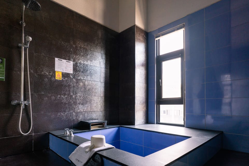 Deluxe Double Room | Bathroom | Separate tub and shower, spring water tub, free toiletries, hair dryer