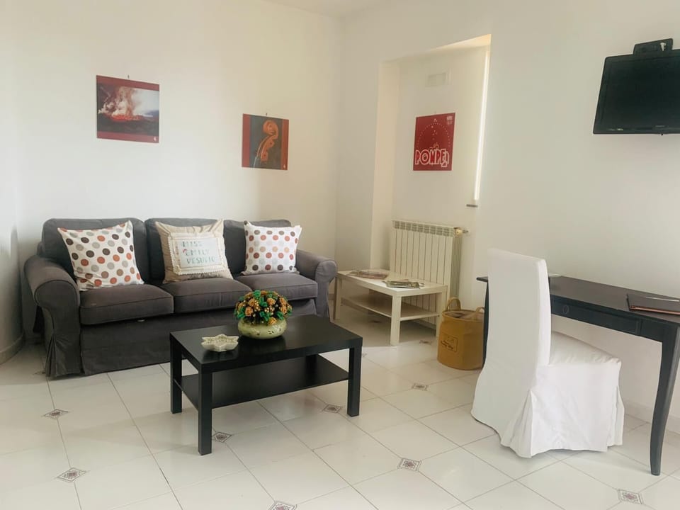 Superior Quadruple Room | Living area | Flat-screen TV
