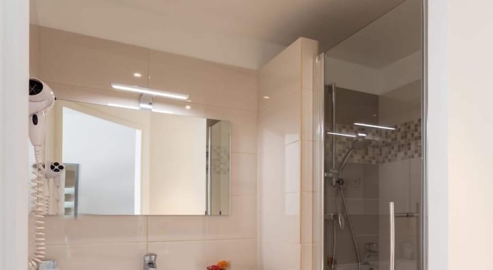 Shower, free toiletries, hair dryer, towels