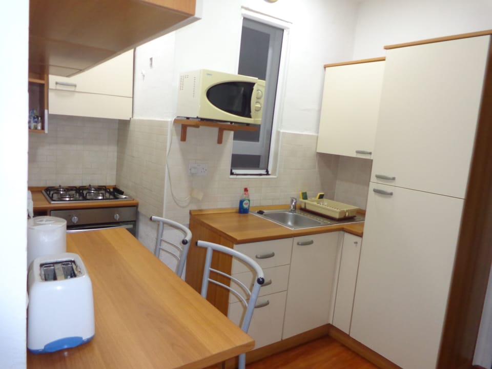 Apartment, 2 Bedrooms, Smoking, Balcony | Private kitchen | Coffee/tea maker, electric kettle, dining tables