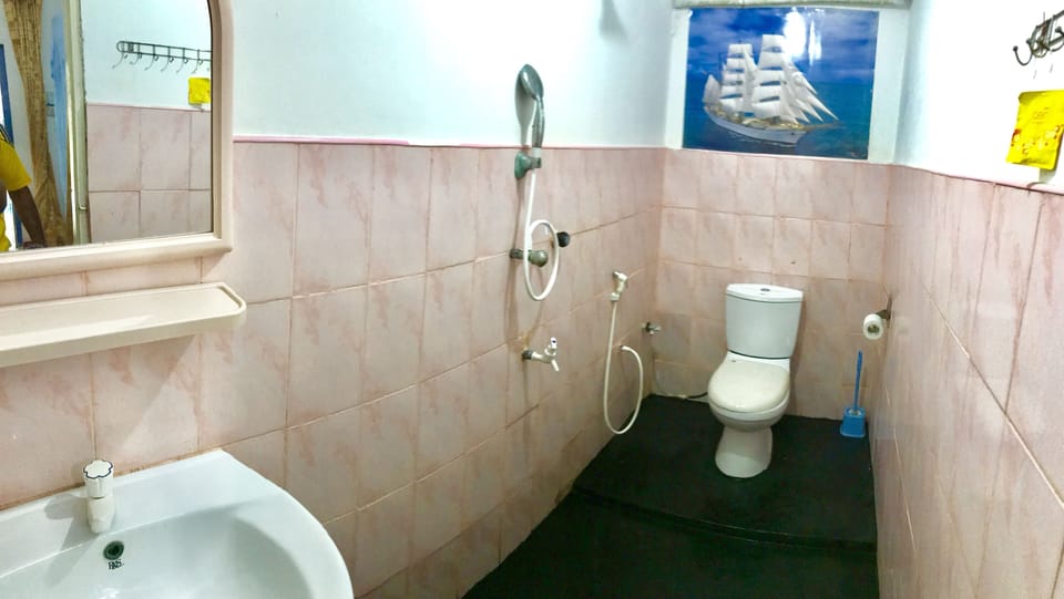 Separate tub and shower, free toiletries, hair dryer, slippers