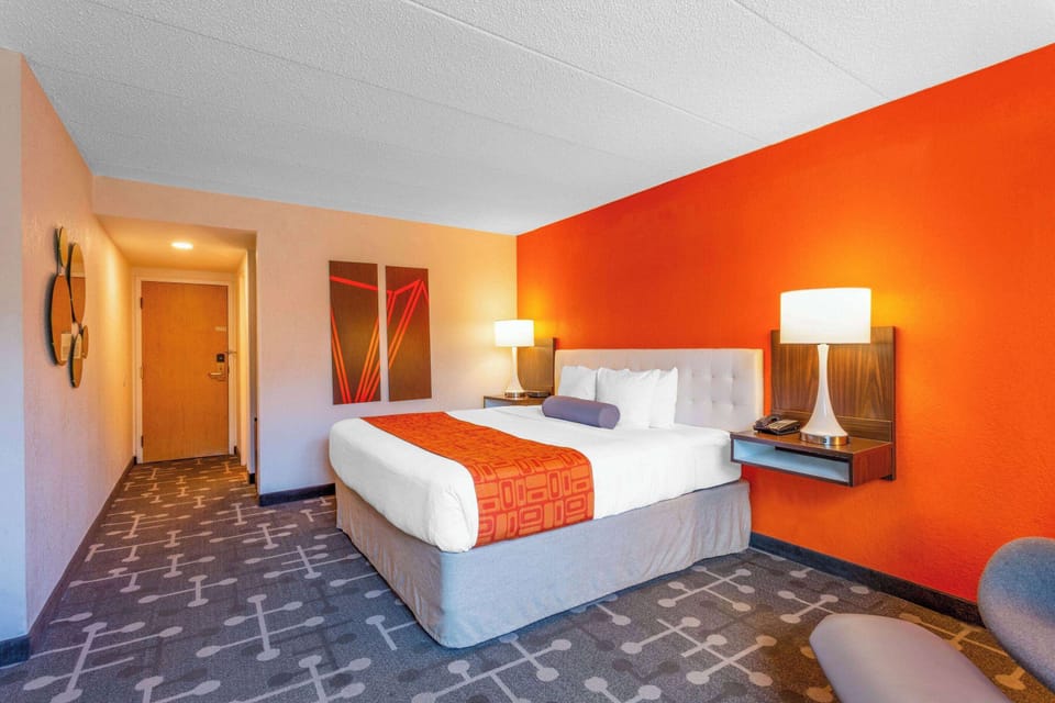 Desk, laptop workspace, blackout drapes, iron/ironing board