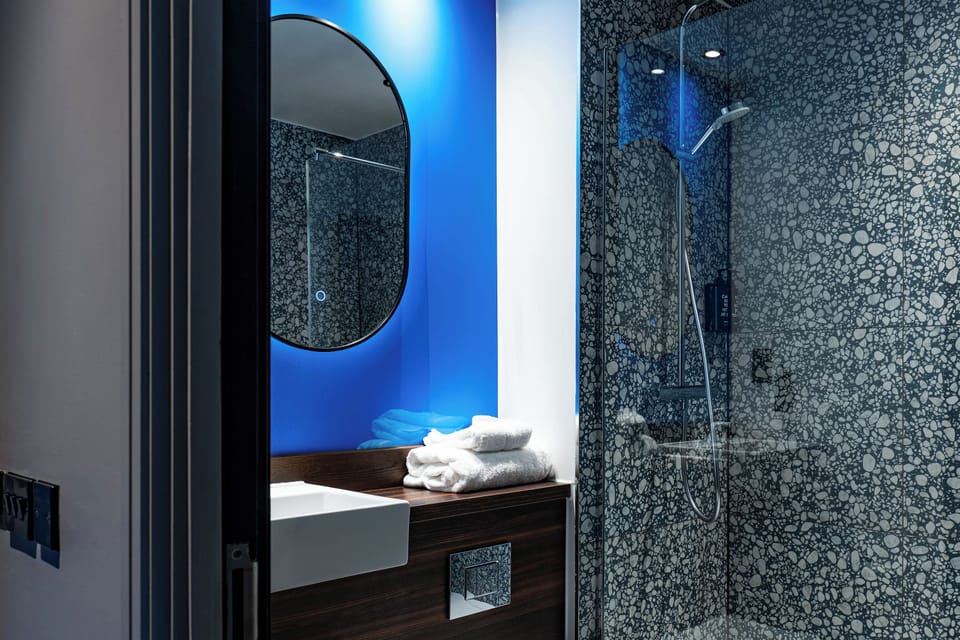 Rainfall showerhead, eco-friendly toiletries, hair dryer, towels