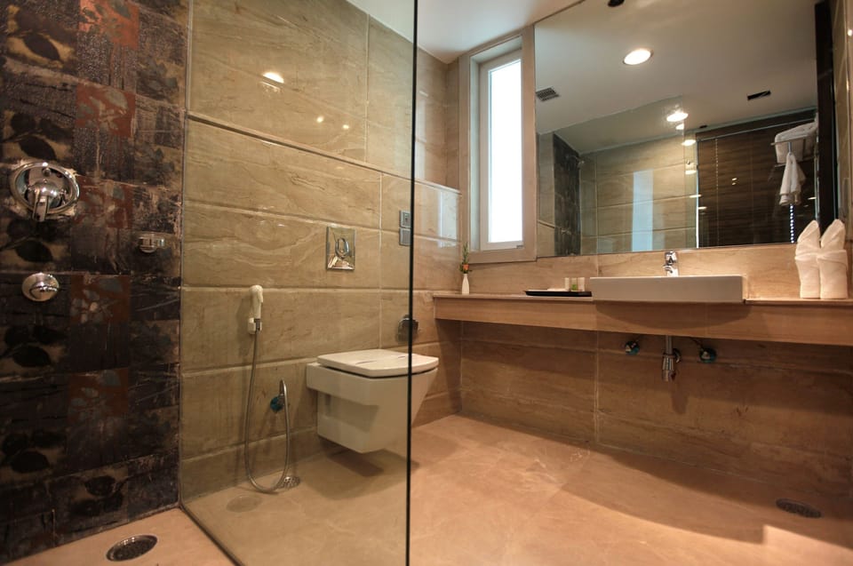 Shower, designer toiletries, hair dryer, bathrobes