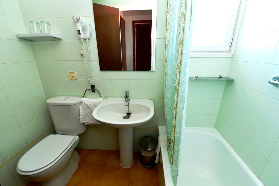 Bathtub, hair dryer, towels
