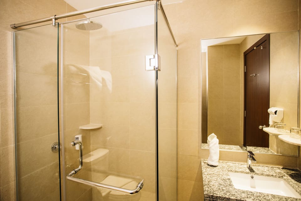 Shower, rainfall showerhead, hair dryer (on request), towels