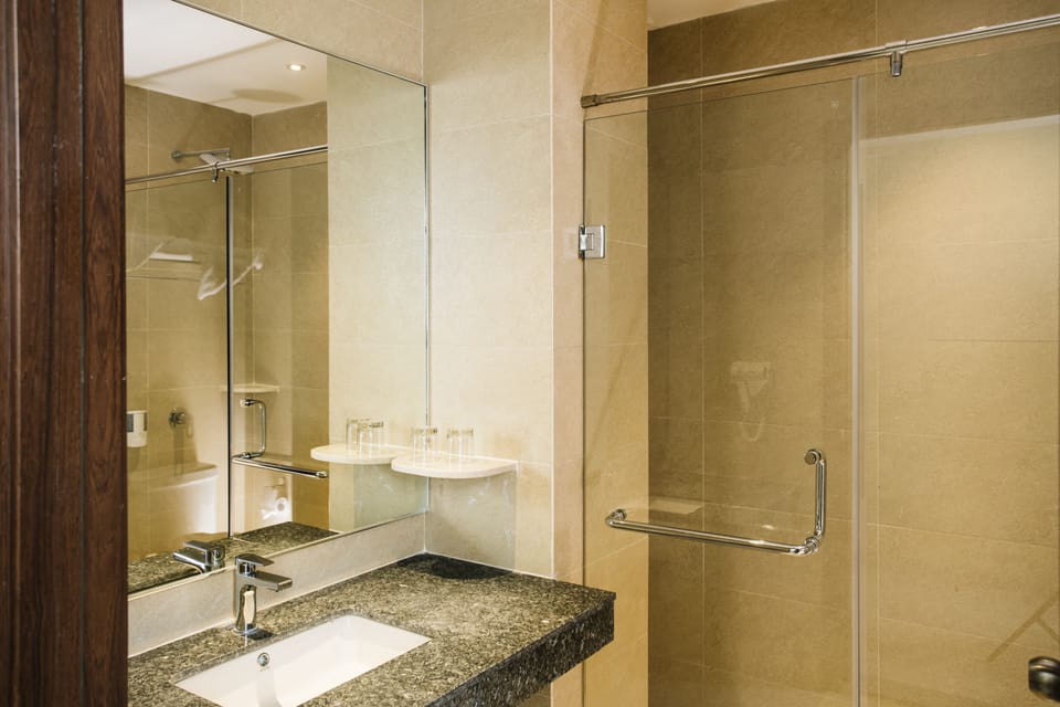 Shower, rainfall showerhead, hair dryer (on request), towels