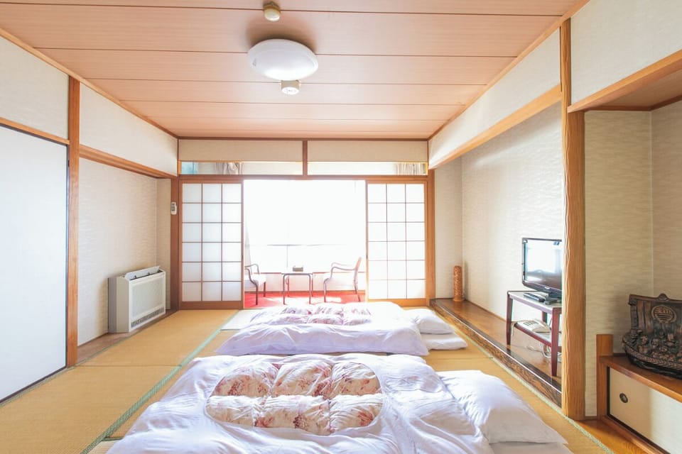 Japanese Triple Room with Shared Bathroom, Non Smoking | WiFi (free), bed sheets