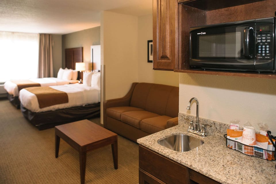 Suite, 2 Queen Beds, Non Smoking | Premium bedding, down comforters, blackout drapes, iron/ironing board