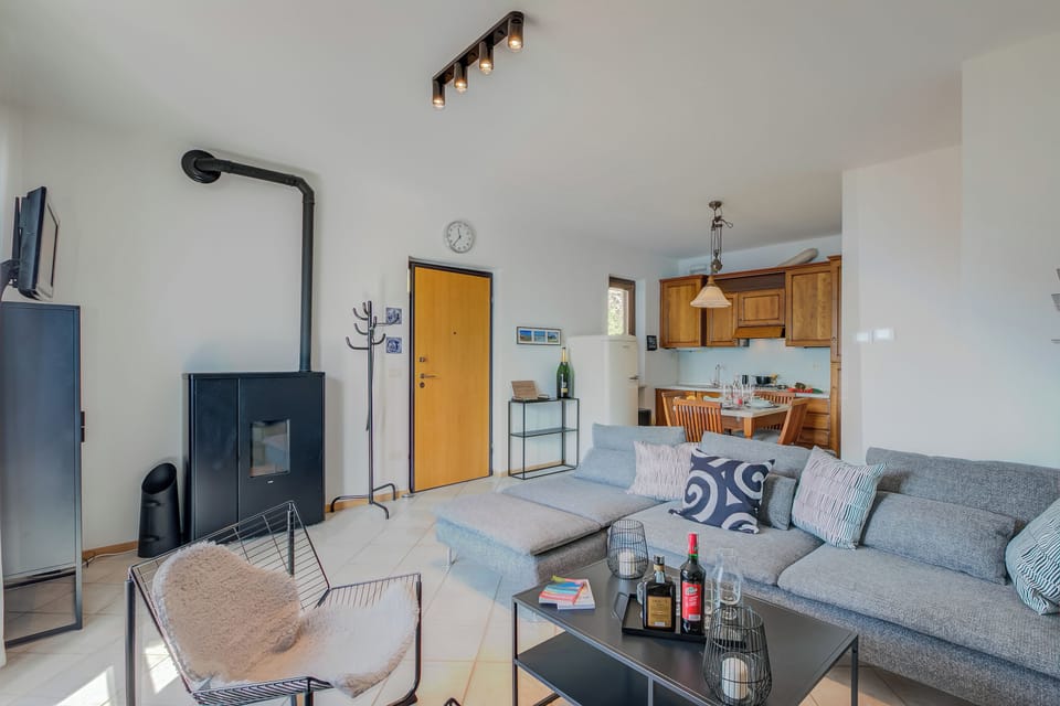 Family Apartment, Multiple Bedrooms, Mountainside (Balcone sul Lago) | Living area | Flat-screen TV