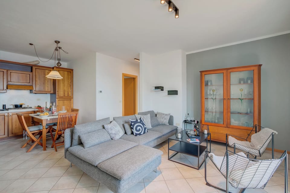 Family Apartment, Multiple Bedrooms, Mountainside (Balcone sul Lago) | Living area | Flat-screen TV