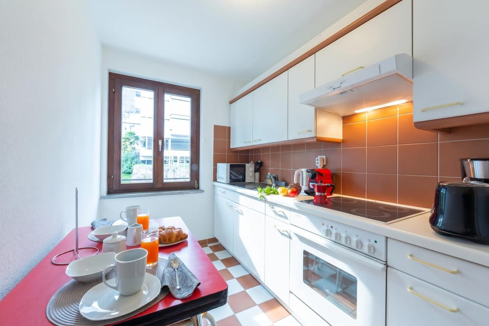 Family Apartment, 1 Bedroom, Balcony (Casa Chiara Muralto) | Private kitchen | Full-size fridge, microwave, oven, stovetop