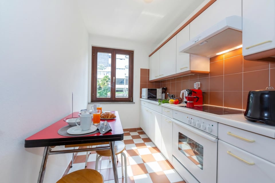 Family Apartment, 1 Bedroom, Balcony (Casa Chiara Muralto) | Private kitchen | Full-size fridge, microwave, oven, stovetop