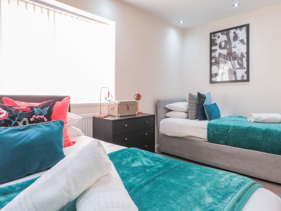 Business Townhome | 4 bedrooms, Egyptian cotton sheets, premium bedding, blackout drapes