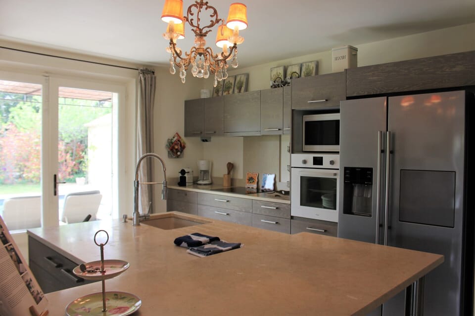 Villa | Private kitchen | Fridge, highchair