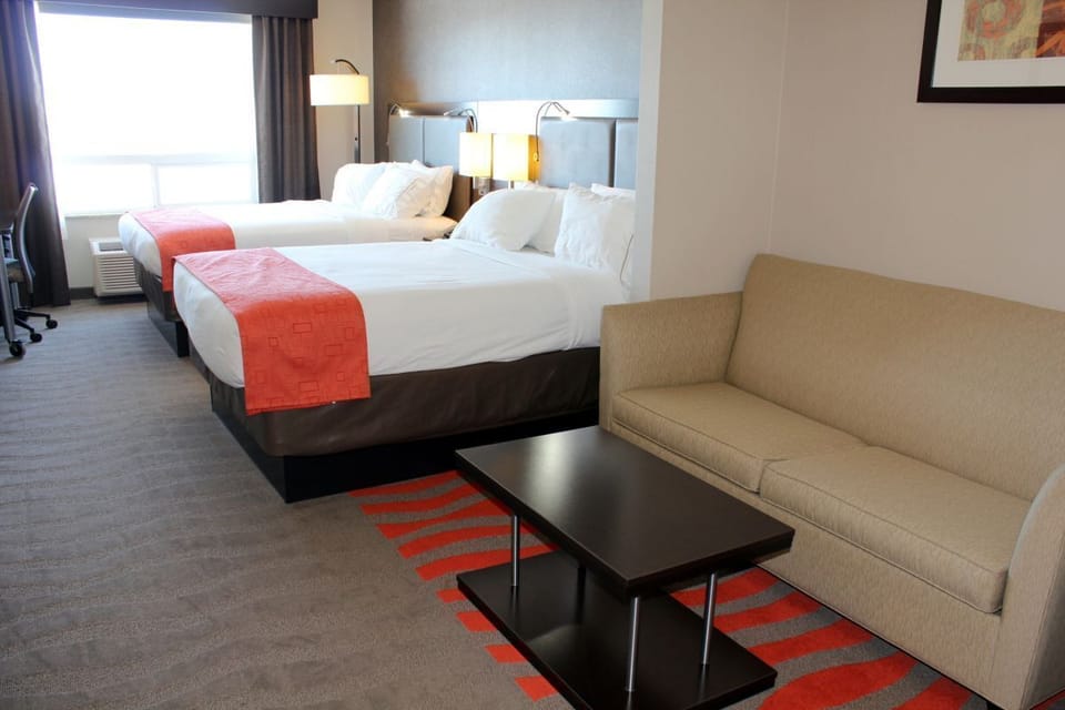 Suite Room with Two Queen Beds plus Sofa Bed in Living area | Living area | 37-inch LCD TV with digital channels