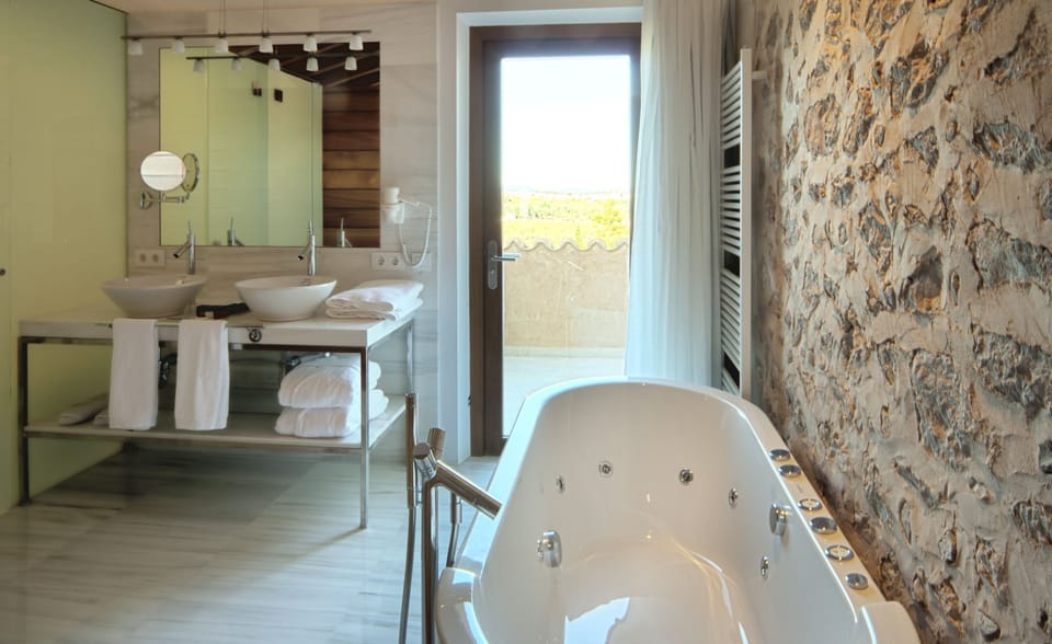 Suite | Bathroom | Designer toiletries, hair dryer, bathrobes, slippers