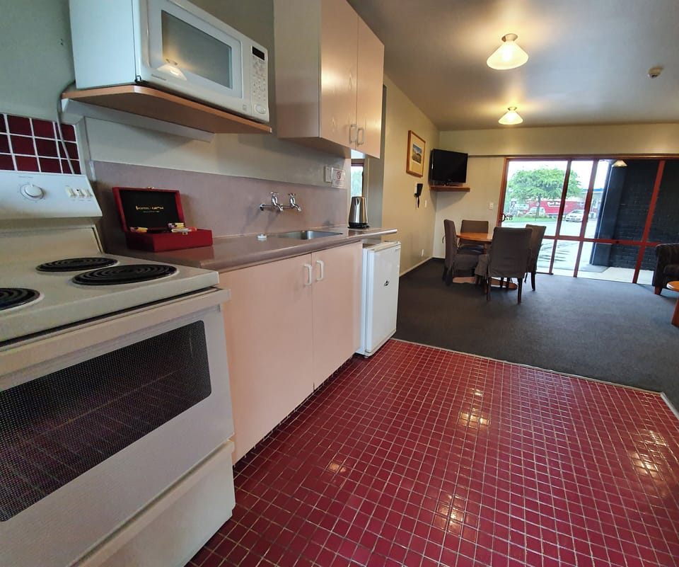 Family Two Bedroom Suite with Kitchen | Private kitchen | Fridge, coffee/tea maker