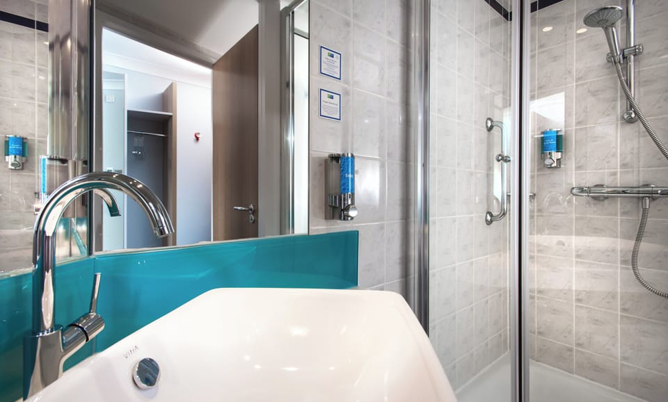 Shower, eco-friendly toiletries, hair dryer, towels