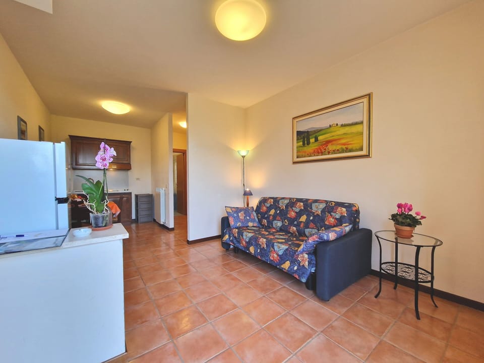 Apartment, 1 Bedroom (2 Adults + 2 children) | Living area | 22-inch flat-screen TV with digital channels, TV, toys