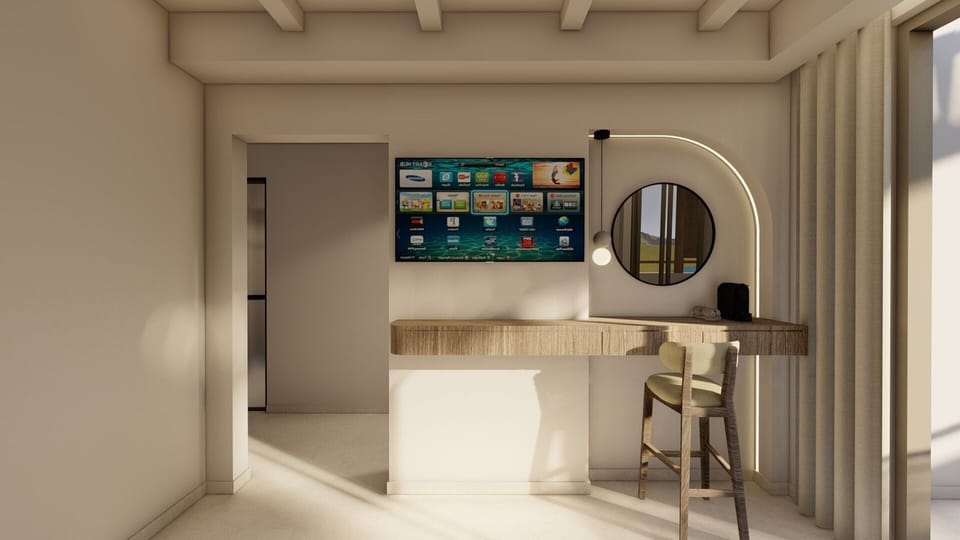 Junior Suite, Hot Tub, Sea View | Living area | TV, books