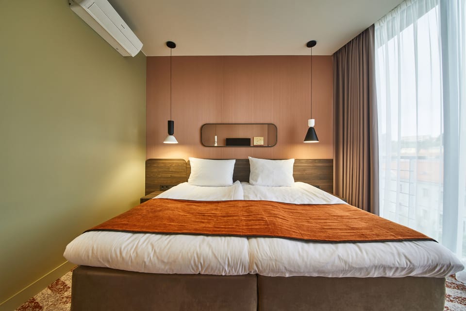 Standard Double or Twin Room | Minibar, in-room safe, desk, blackout drapes